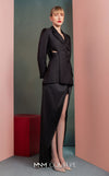 MNM Couture GOF2542 ensemble, with an asymmetrical black mikado piqué blazer featuring side cut-outs and button details, paired with a dramatic high-slit black taffeta skirt. | Couture Shop LA