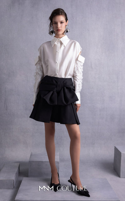 MNM Couture GOS2519 Black piqué skirt with bow design and off-white taffeta blouse with embroidered sleeves and cut-out shoulders. | Couture Shop LA