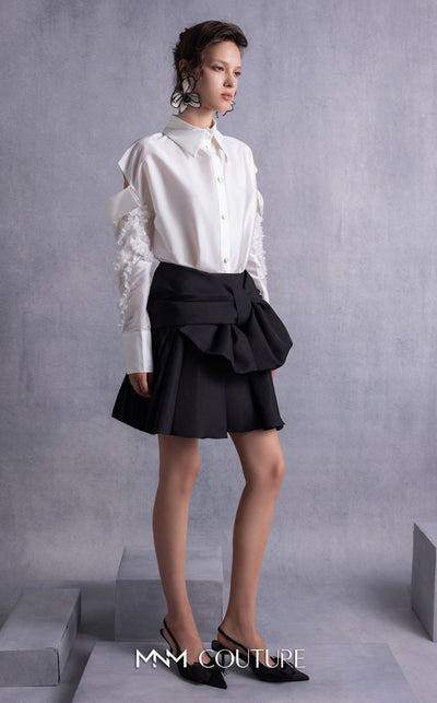 MNM Couture GOS2519 Black piqué skirt with bow design and off-white taffeta blouse with embroidered sleeves and cut-out shoulders. | Couture Shop LA