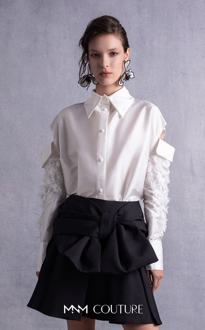 MNM Couture GOS2519 Black piqué skirt with bow design and off-white taffeta blouse with embroidered sleeves and cut-out shoulders. | Couture Shop LA