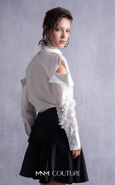 MNM Couture GOS2519 Black piqué skirt with bow design and off-white taffeta blouse with embroidered sleeves and cut-out shoulders. | Couture Shop LA