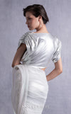 MNM Couture GOS2523 Silver lamé lycra dress with cutout design, side knot, draped tulle, and ribbed lamé organza accents. | Couture Shop LA