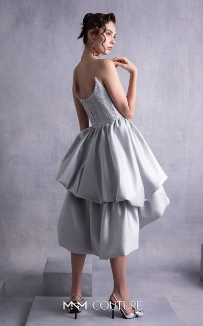 MNM Couture GOS2538 Silver mikado piqué strapless dress with angled bust design and layered ruffled skirt. | Couture Shop LA