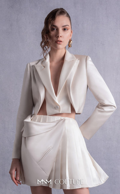 MNM Couture GOS2539 Pleated gold champagne razmir skirt with draped accents and cropped razmir jacket with tailored lapels. | Couture Shop LA