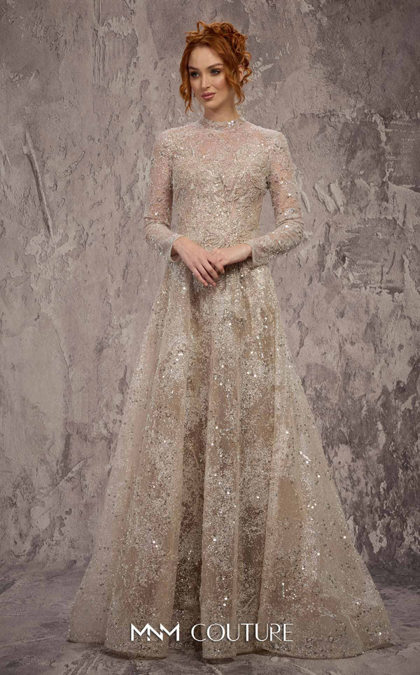 MNM Couture Style J02720 sequined A-line gown with long sleeves, high neckline, and starburst waist detail. \ Couture Shop LA