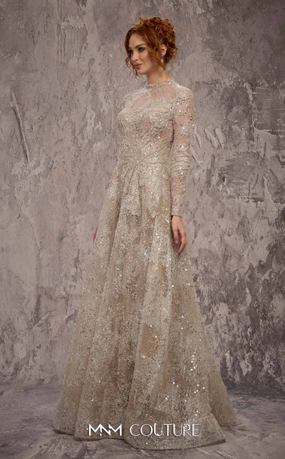 MNM Couture Style J02720 sequined A-line gown with long sleeves, high neckline, and starburst waist detail. \ Couture Shop LA