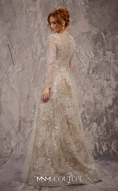 MNM Couture Style J02720 sequined A-line gown with long sleeves, high neckline, and starburst waist detail. \ Couture Shop LA