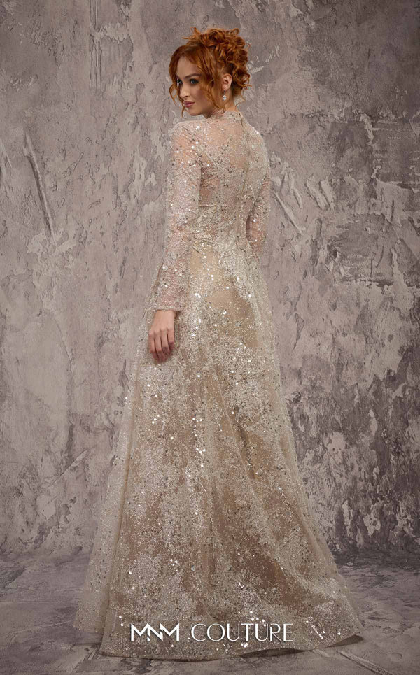 MNM Couture Style J02720 sequined A-line gown with long sleeves, high neckline, and starburst waist detail. \ Couture Shop LA