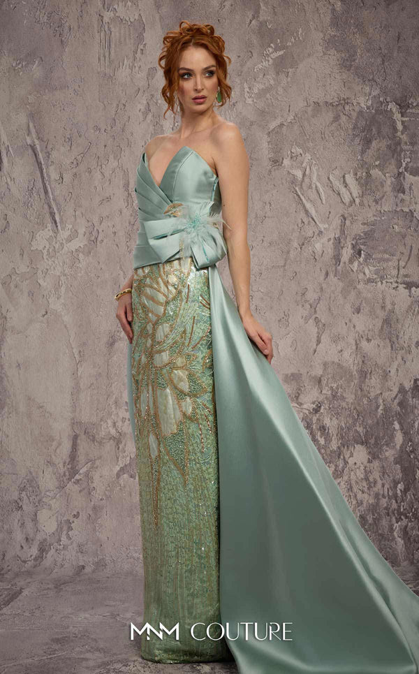 MNM Couture Style J03497 strapless column gown with a beaded skirt, satin train, and asymmetrical deep V-neck. \ Couture Shop LA