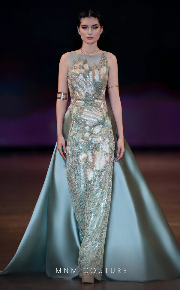 MNM Couture Style J03503 beaded column gown with a double skirt train and sheer neckline. \ Couture Shop LA