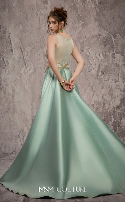 MNM Couture Style J03503 beaded column gown with a double skirt train and sheer neckline. \ Couture Shop LA