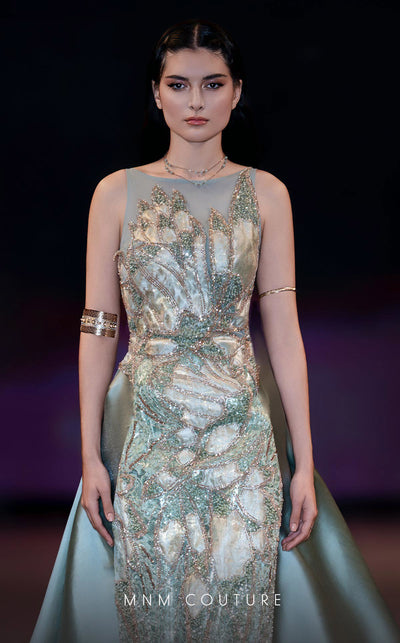 MNM Couture Style J03503 beaded column gown with a double skirt train and sheer neckline. \ Couture Shop LA