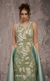 MNM Couture Style J03503 beaded column gown with a double skirt train and sheer neckline. \ Couture Shop LA
