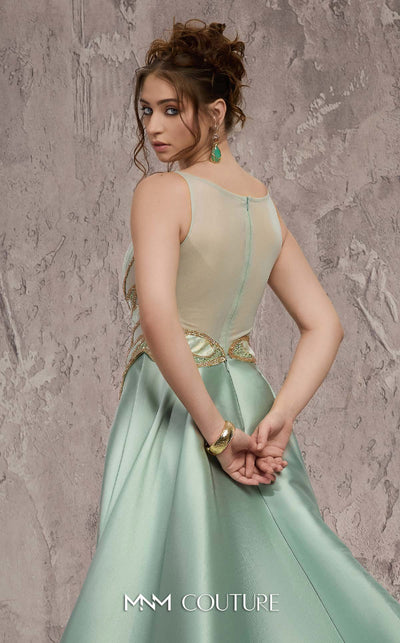 MNM Couture Style J03503 beaded column gown with a double skirt train and sheer neckline. \ Couture Shop LA