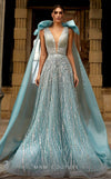 MNM Couture K3923 ballgown with angel cape, deep V-neckline, and mid-open back paired with a sweeping train.