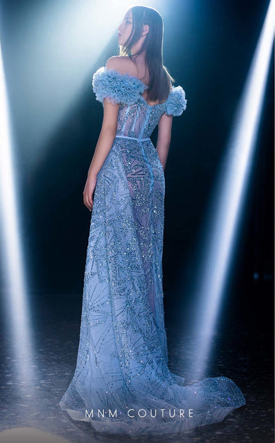 MNM Couture K3963 gown with off-shoulder sleeves, corset-boned bodice, and dramatic cascading ruffles. | Couture Shop LA
