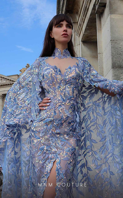 MNM Couture K4012 Beaded column dress with high neckline, cape sleeve, and dramatic slit, perfect for special evenings. | Couture Shop LA