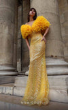 Strapless sequin gown with voluminous ruffle details and fitted silhouette for evening elegance.