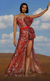 MNM Couture K4047 strapless gown with floral embroidery, sheer skirt, and a dramatic high slit.