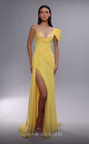 MNM Couture K4085 sheath gown featuring pleated accents, off-shoulder sleeve, and beaded details.