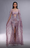 MNM Couture K4091 mermaid gown featuring sheer cape sleeves, a front slit, and stunning embellishments.