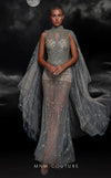 MNM Couture K4119 sheath gown with long cape, high-neck illusion details, and a sweep train.