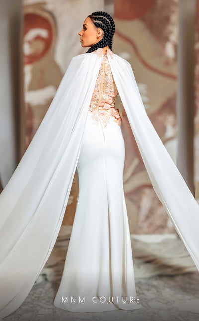 MNM Couture K4145 rayon crepe mesh column dress featuring a halter neckline and elegant train capes. | Couture Shop LA