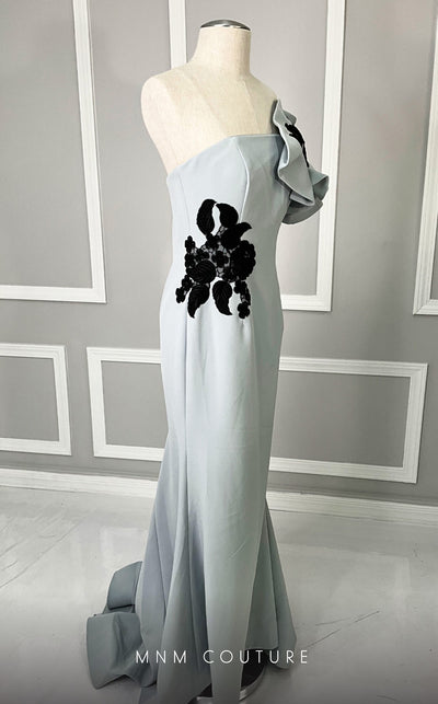 MNM Couture M0042 red crepe gown with dramatic ruffled sleeve and black floral embroidery. | Couture Shop LA