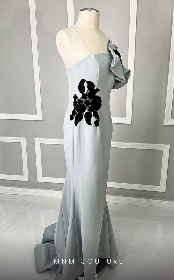 MNM Couture M0042 red crepe gown with dramatic ruffled sleeve and black floral embroidery. | Couture Shop LA