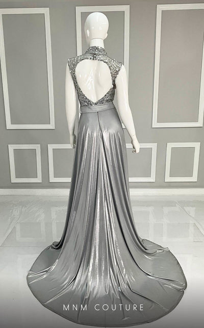 MNM Couture M0085 chiffon gown with flowing cape, beaded bodice, and daring side slits. | Couture Shop LA