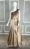 Elegant long dress with asymmetric neckline, delicate embroidery, and a dramatic train, perfect for special occasions.