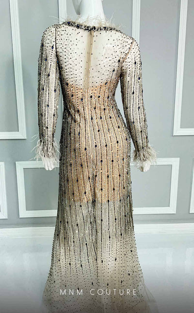 A captivating MNM Couture gown M1128, exhibiting exquisite feather details and diamond beading on elegant tulle. | Couture Shop LA