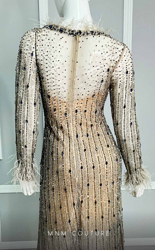 A captivating MNM Couture gown M1128, exhibiting exquisite feather details and diamond beading on elegant tulle. | Couture Shop LA