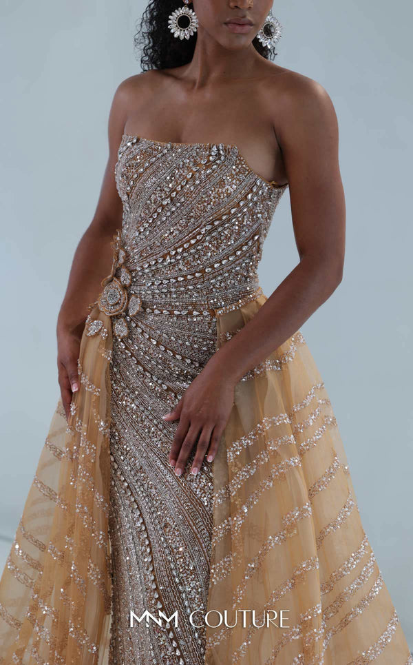 MNM Couture M1186 showcasing a sleeveless, form-fitting mermaid gown fully embellished with sequins, beads, and diamonds, featuring a deep illusion U-neckline. | Couture Shop LA