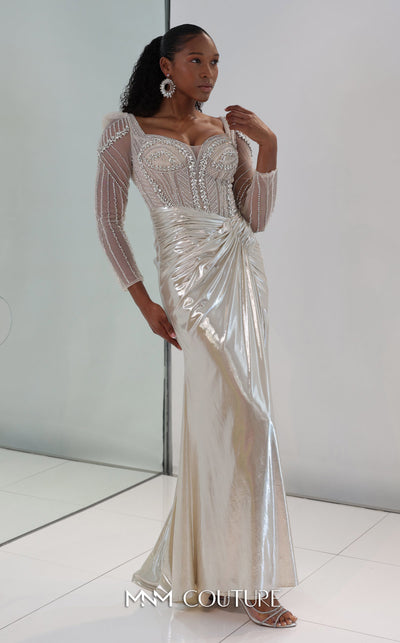 MNM Couture M1312 in gold Lycra satin, showcasing a mermaid silhouette with a beaded illusion bodice, long sheer sleeves, and a draped, gathered waist. | Couture Shop LA