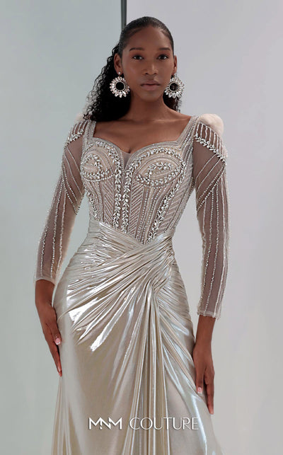 MNM Couture M1312 in gold Lycra satin, showcasing a mermaid silhouette with a beaded illusion bodice, long sheer sleeves, and a draped, gathered waist. | Couture Shop LA