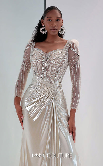 MNM Couture M1312 in gold Lycra satin, showcasing a mermaid silhouette with a beaded illusion bodice, long sheer sleeves, and a draped, gathered waist. | Couture Shop LA
