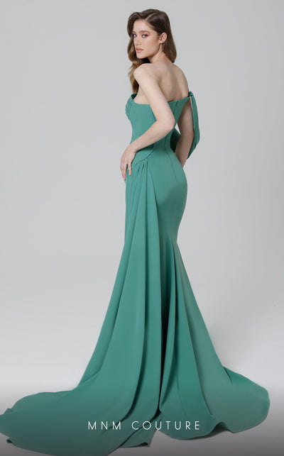 MNM Couture N0473 off-shoulder sheath gown with side slit and a cascading sash. | Couture Shop LA