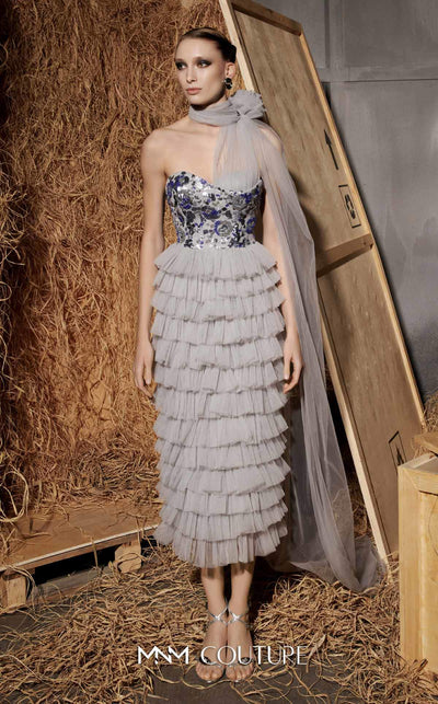 MNM Couture Style N0641 silver column maxi dress with corset-style embroidered bodice, sequins, layered organza skirt, flower-shaped neckline detail, and long train | Couture Shop LA