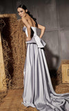 MNM Couture Style N0648 silver silk column dress featuring a sweetheart neckline, peplum corset bodice, floral embroidery with sequins, a fitted skirt, and a dramatic back train for an elegant silhouette | Couture Shop LA