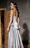 MNM Couture Style N0648 silver silk column dress featuring a sweetheart neckline, peplum corset bodice, floral embroidery with sequins, a fitted skirt, and a dramatic back train for an elegant silhouette | Couture Shop LA