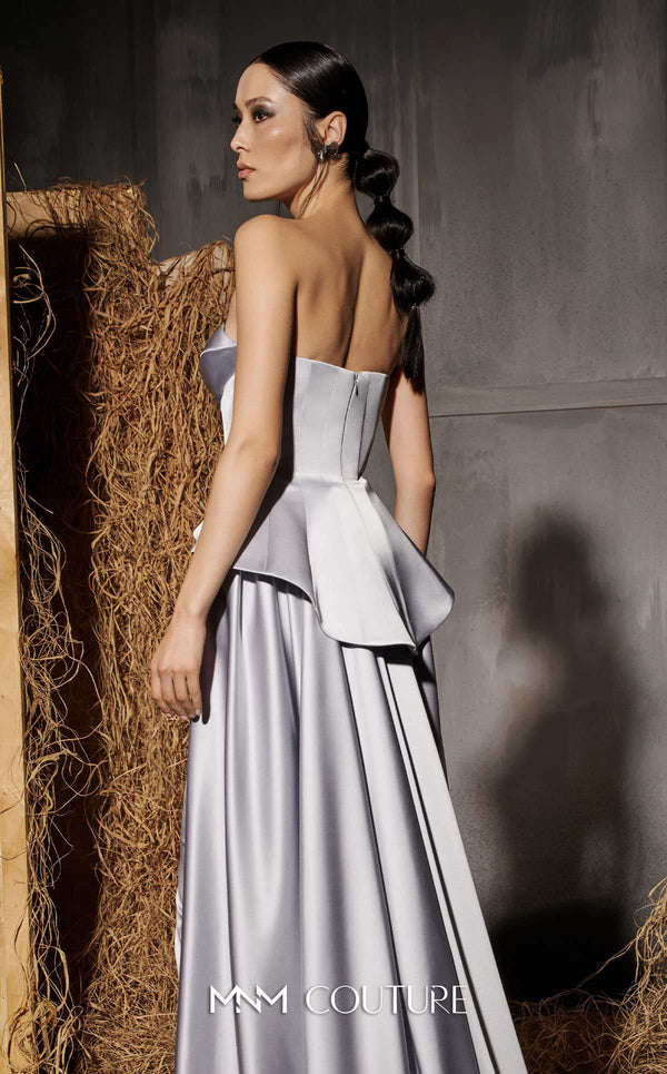 MNM Couture Style N0648 silver silk column dress featuring a sweetheart neckline, peplum corset bodice, floral embroidery with sequins, a fitted skirt, and a dramatic back train for an elegant silhouette | Couture Shop LA