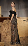 MNM Couture Style N0665 - Elegant black embroidered column gown featuring a see-through sequined skirt, side tassel, and asymmetrical sleeve design | Couture Shop LA