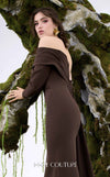 MNM Couture Style N0674 showcasing a brown fitted column gown with straight-across pleated neckline, long sleeves, asymmetrical design, flower brooch, and flowing train | Couture Shop LA