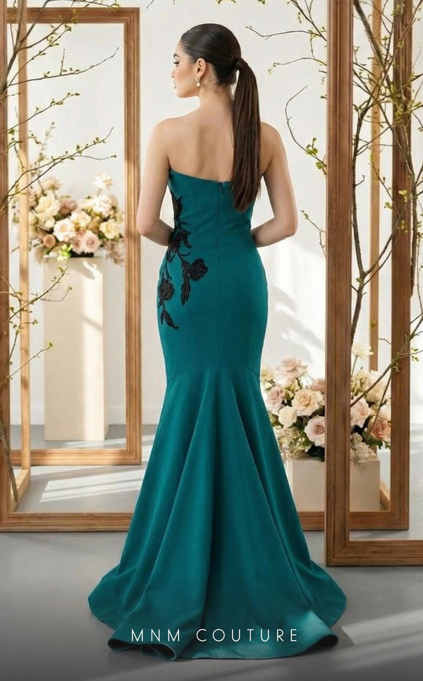MNM Couture N0700 green and purple crepe column gown with leather floral appliqués, asymmetrical neckline, and trumpet train | Couture Shop LA