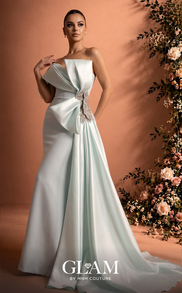 MNM Couture O07802 one-shoulder crepe organza column gown with draped bodice, crystal bow, and side train