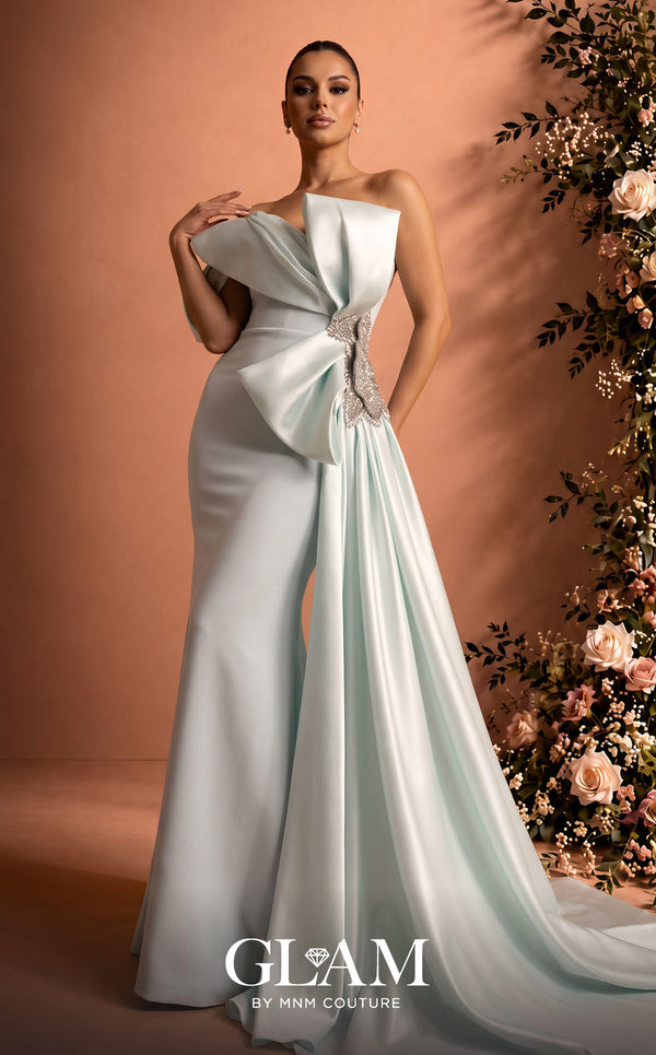 MNM Couture O07802 one-shoulder crepe organza column gown with draped bodice, crystal bow, and side train