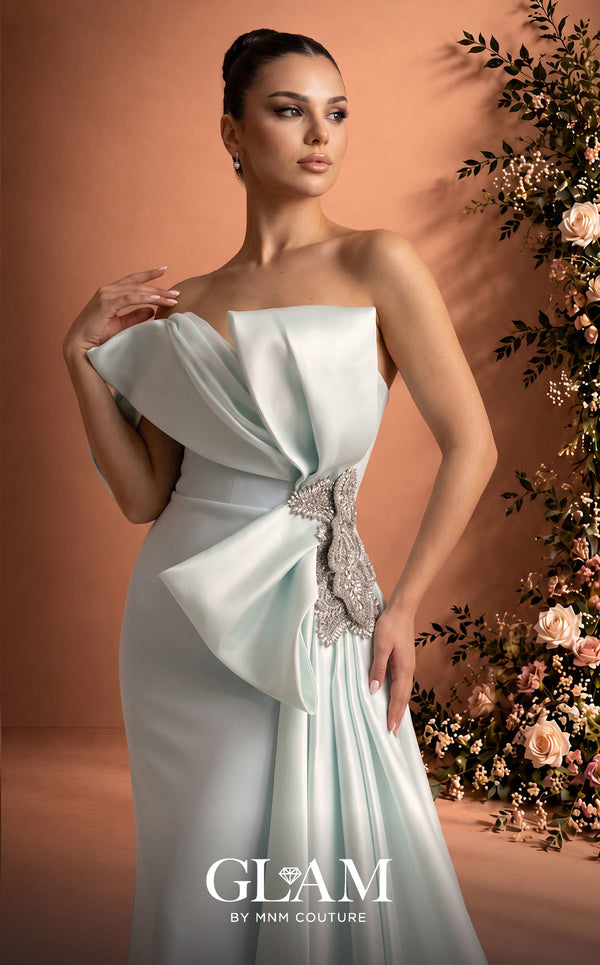 MNM Couture O07802 one-shoulder crepe organza column gown with draped bodice, crystal bow, and side train