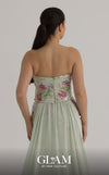 MNM Couture O07858 strapless lace column gown with exposed corsetry, crystals, pearls, and chiffon train