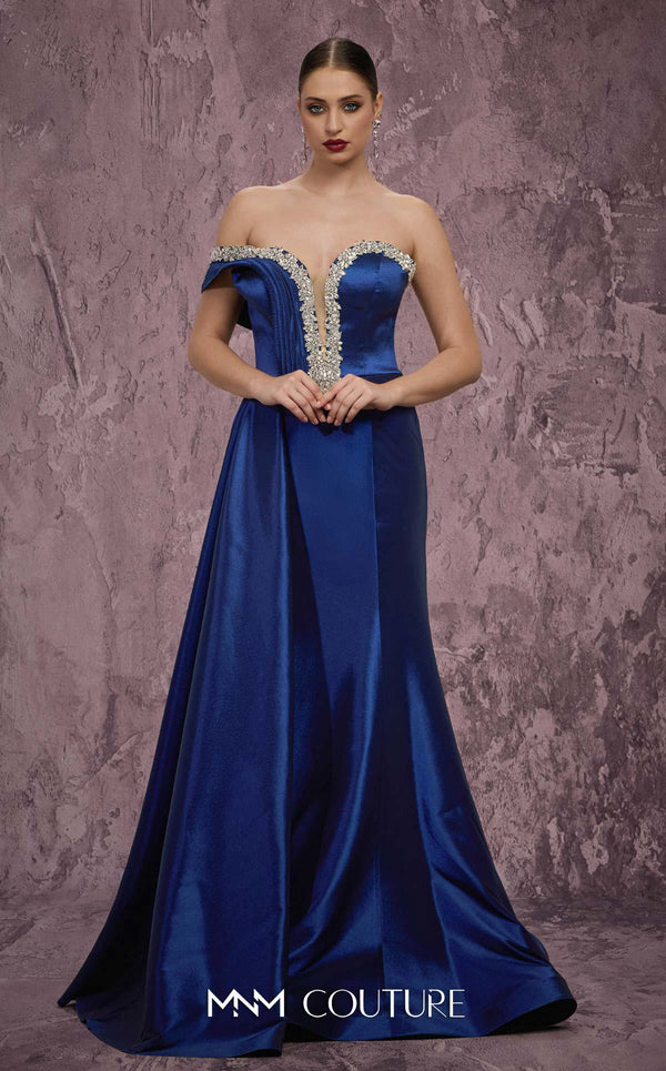 MNM Couture Style Q2414 mermaid gown with a deep V-neckline, embellished bodice, and side train. \ Couture Shop LA